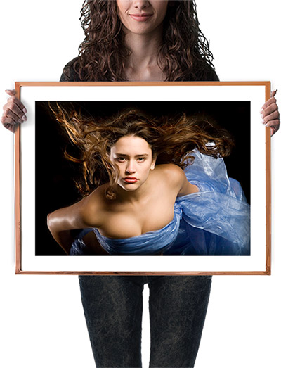 fine art print held by woman